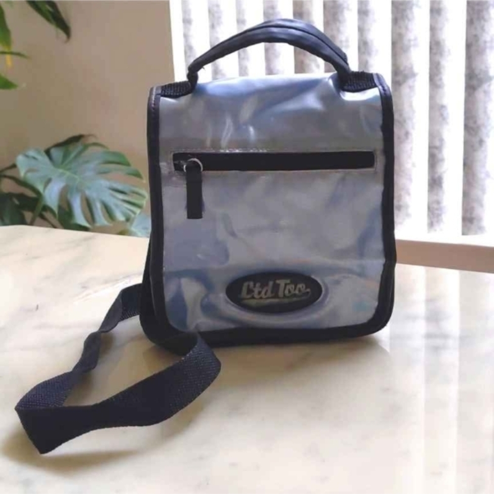 Limited Too Shining blue crossbody bag w/lots of pockets and adjustable strap.